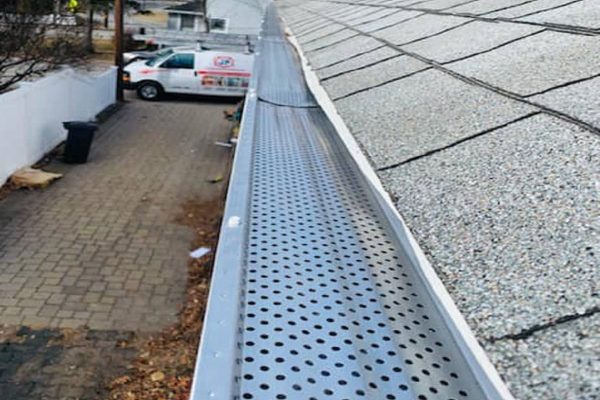 Downspout extension directing water away from foundation